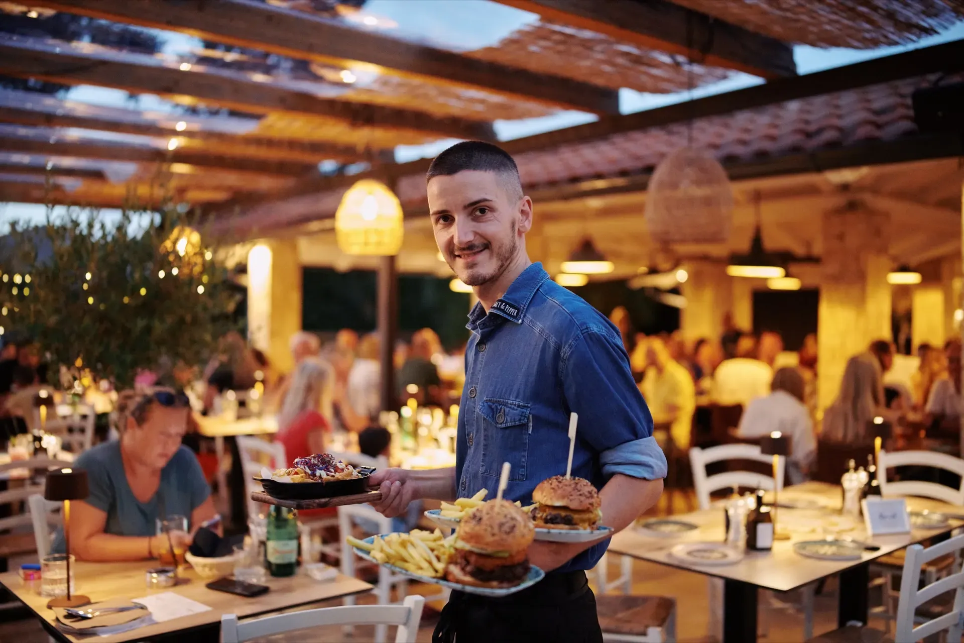 Full terrace at Salt & Pepper on a summer evening